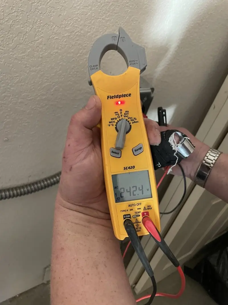 Voltage testing with clamp meter during Aluminum Wiring Replacement in St. Charles